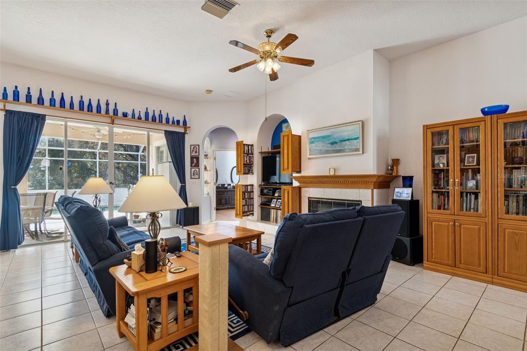 928 Oakview Road Tarpon Springs, FL 34689 - Photo 21 of 75 a living room with furniture a table and a large window