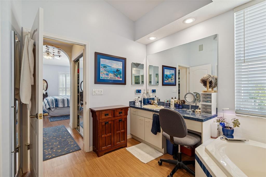 928 Oakview Road Tarpon Springs, FL 34689 - Photo 31 of 75 a view of a workspace room with wooden floor and furniture