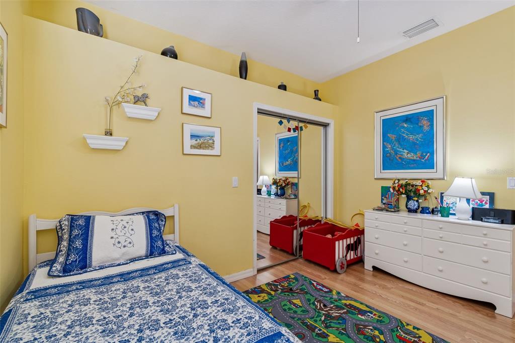 928 Oakview Road Tarpon Springs, FL 34689 - Photo 40 of 75 a bedroom with furniture and wooden floor