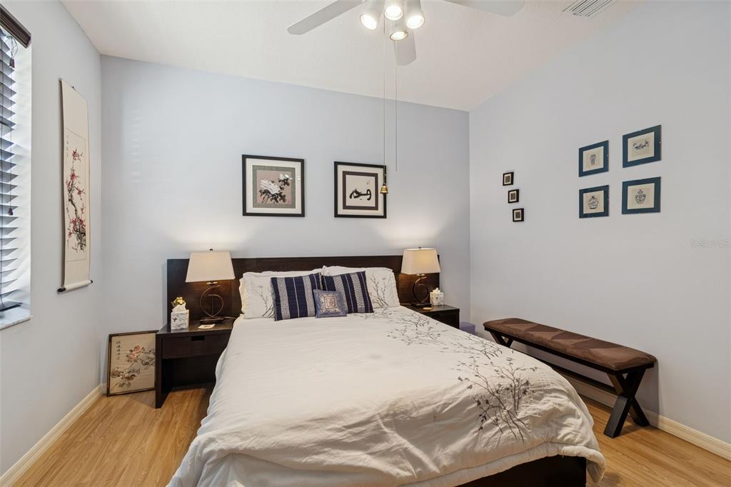 928 Oakview Road Tarpon Springs, FL 34689 - Photo 42 of 75 a bed room with a bed and a night stand