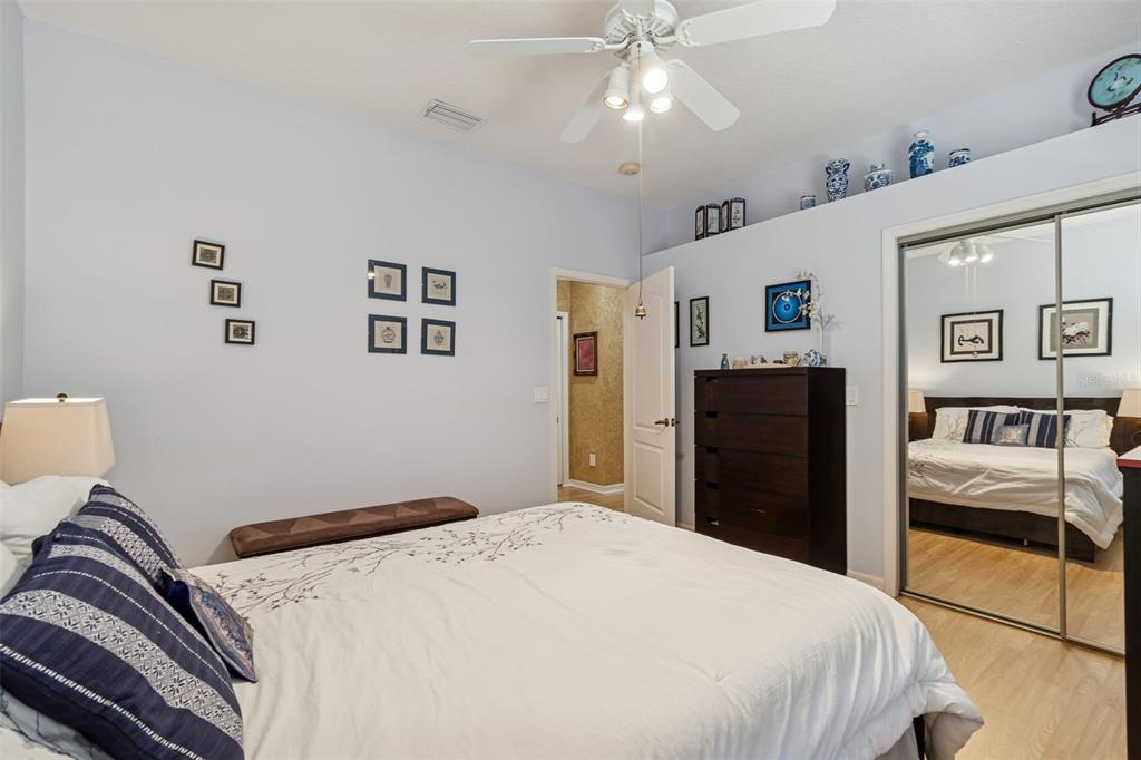 928 Oakview Road Tarpon Springs, FL 34689 - Photo 43 of 75 a bedroom with a bed and wooden floor