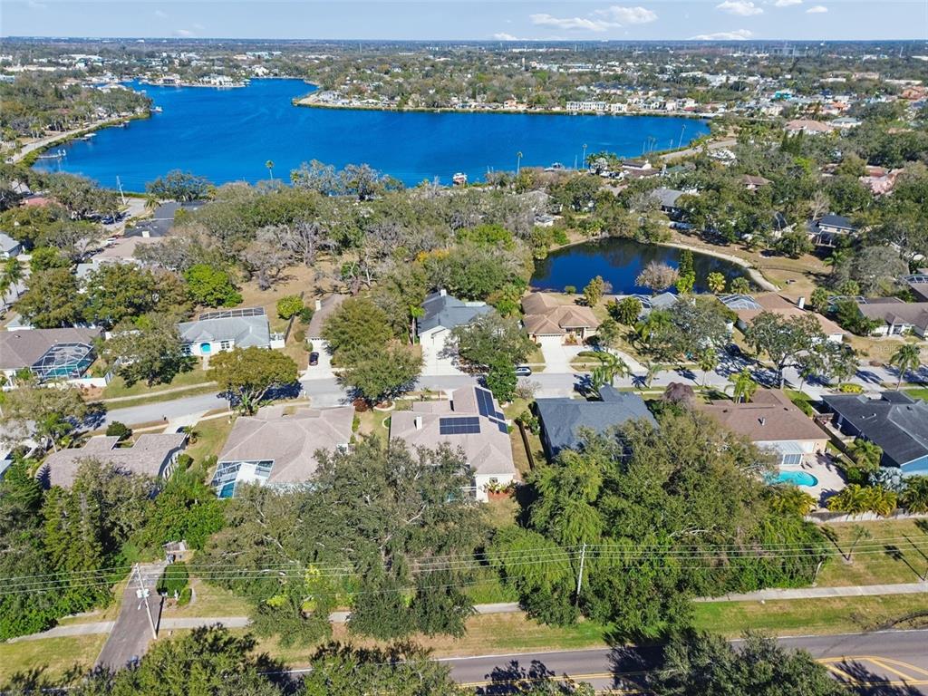 928 Oakview Road Tarpon Springs, FL 34689 - Photo 61 of 75 an aerial view of a house with a yard and lake view