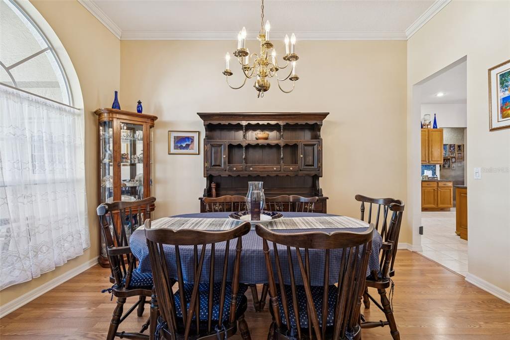 928 Oakview Road Tarpon Springs, FL 34689 - Photo 9 of 75 a view of a dining room with furniture wooden floor and chandelier