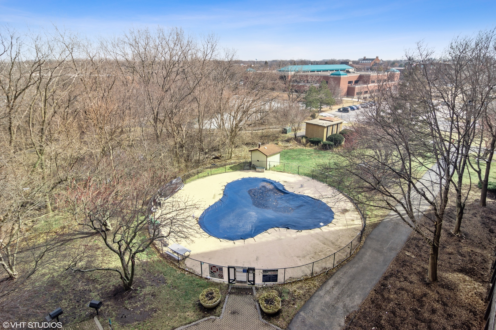 1 Renaissance Place, Unit 509 Palatine, IL 60067 - Photo 16 of 21 a view of a swimming pool with a yard and large trees