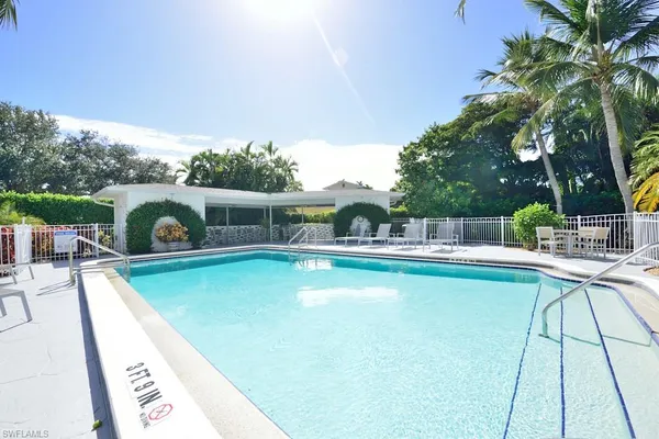 a view of a swimming pool with a patio