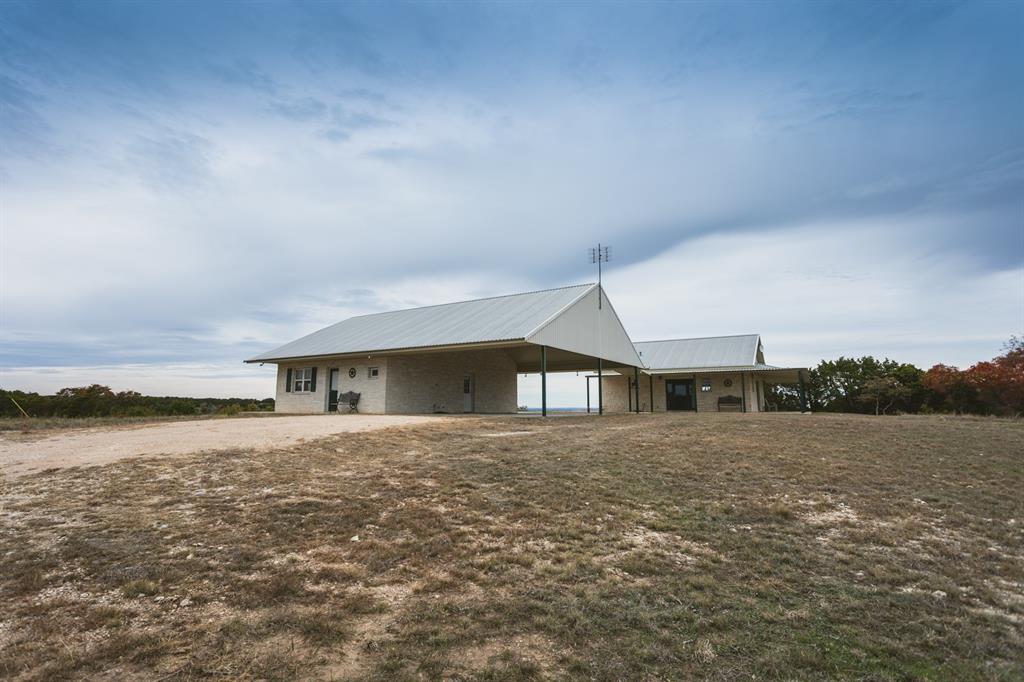 470 County Road 2137 Meridian, TX 76665 - Photo 1 of 1 a view of a big house with a big yard and large trees