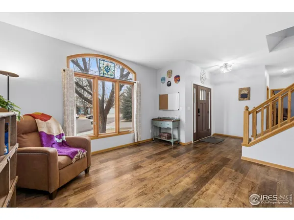 a bedroom with furniture and a window