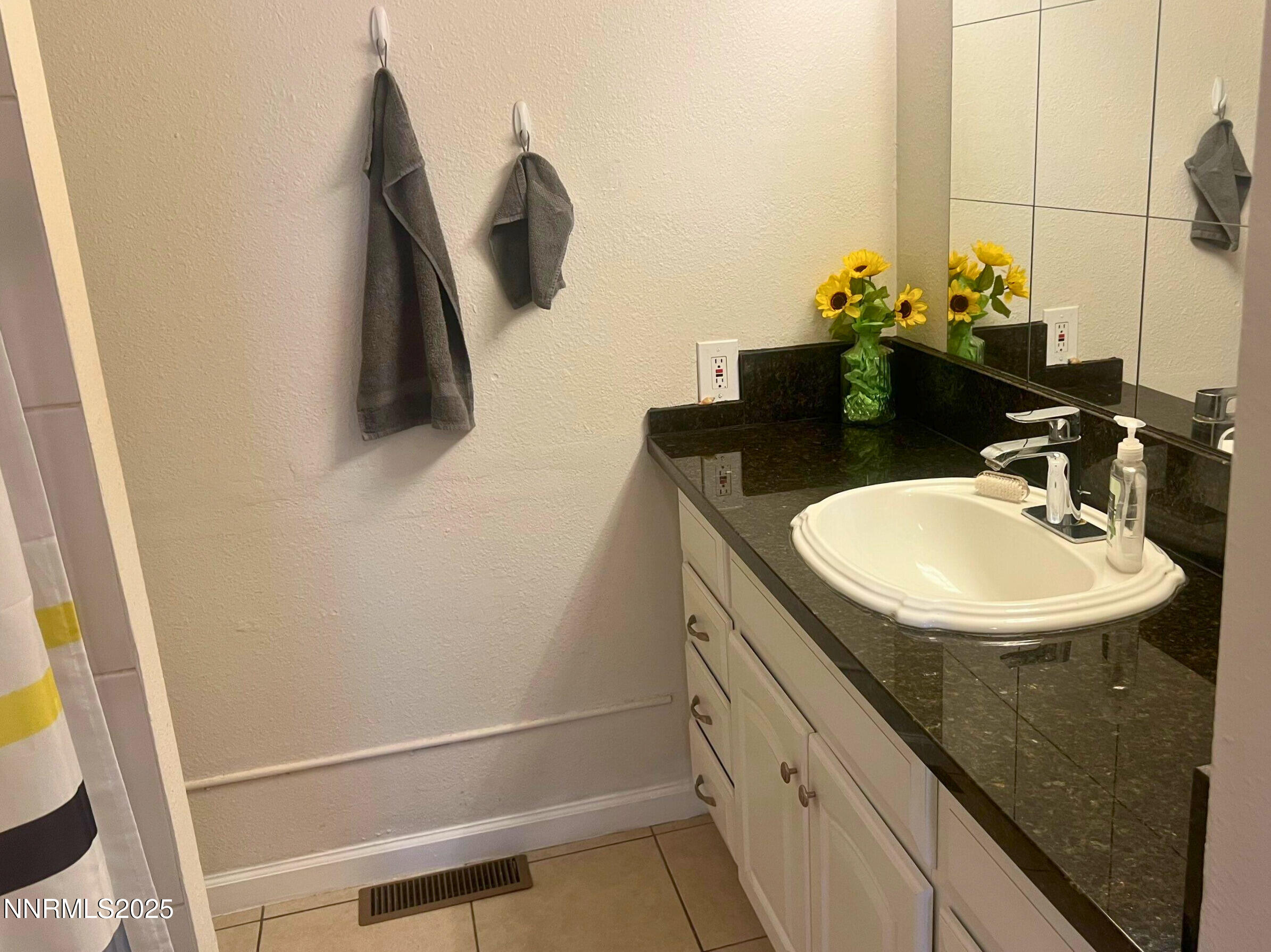 1995 Trainer Way Reno, NV 89512 - Photo 7 of 11 a bathroom with a sink and a mirror