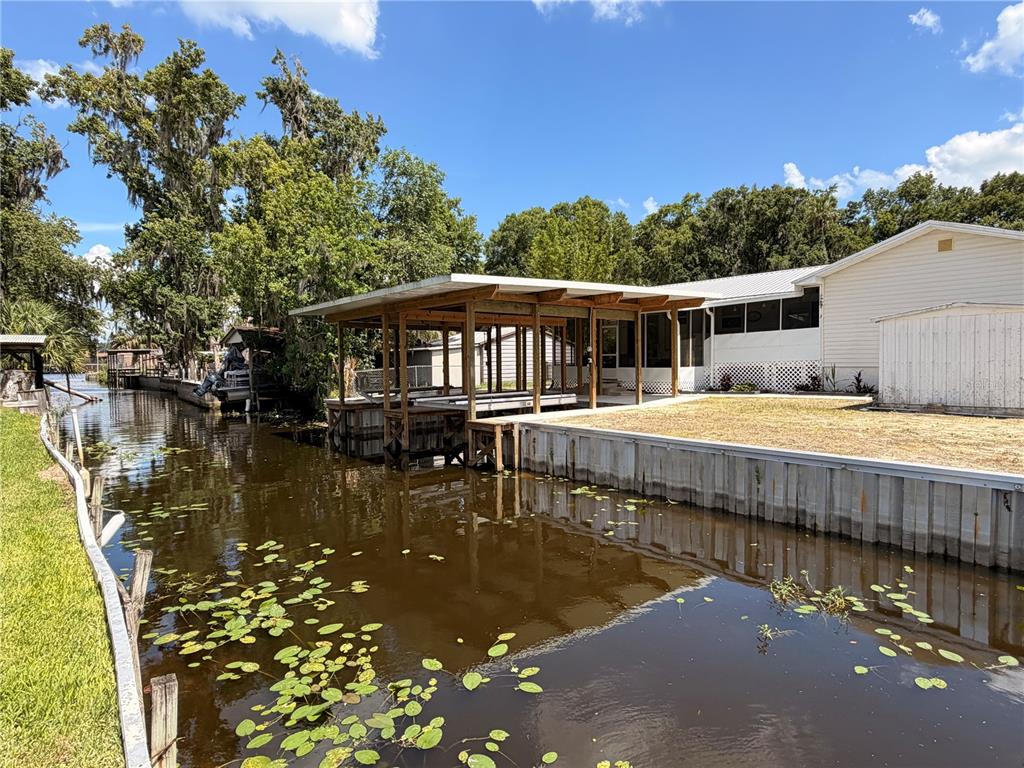 24521 Alligator Road Astor, FL 32102 - Photo 50 of 51 a view of a swimming pool with a patio