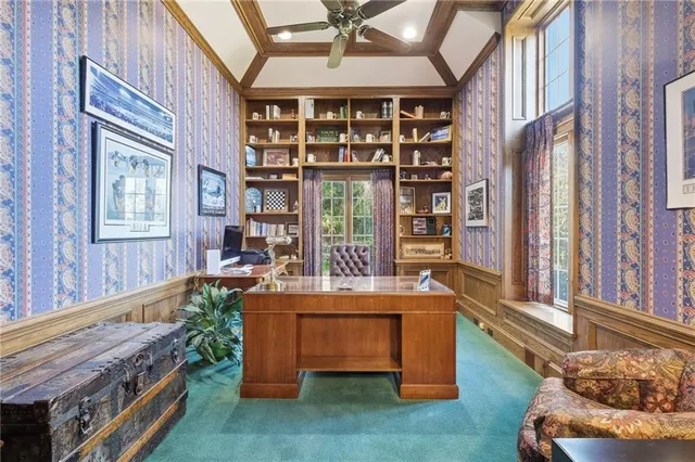 a room with fireplace furniture and windows