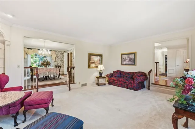a bedroom with furniture and wooden floor