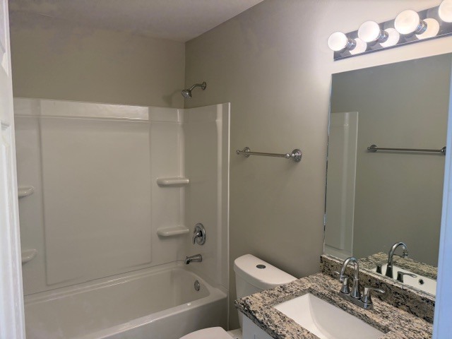 588 Nantucket Way, Unit 2 Island Lake, IL 60042 - Photo 13 of 29 a bathroom with a granite countertop sink mirror toilet and bathtub