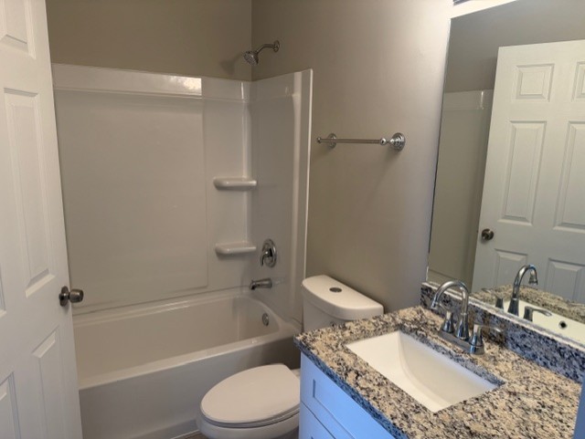 588 Nantucket Way, Unit 2 Island Lake, IL 60042 - Photo 24 of 29 a bathroom with a granite countertop sink toilet and shower