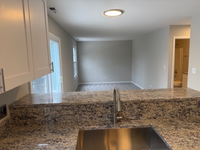 588 Nantucket Way, Unit 2 Island Lake, IL 60042 - Photo 6 of 29 a bathroom with a granite countertop sink and a mirror