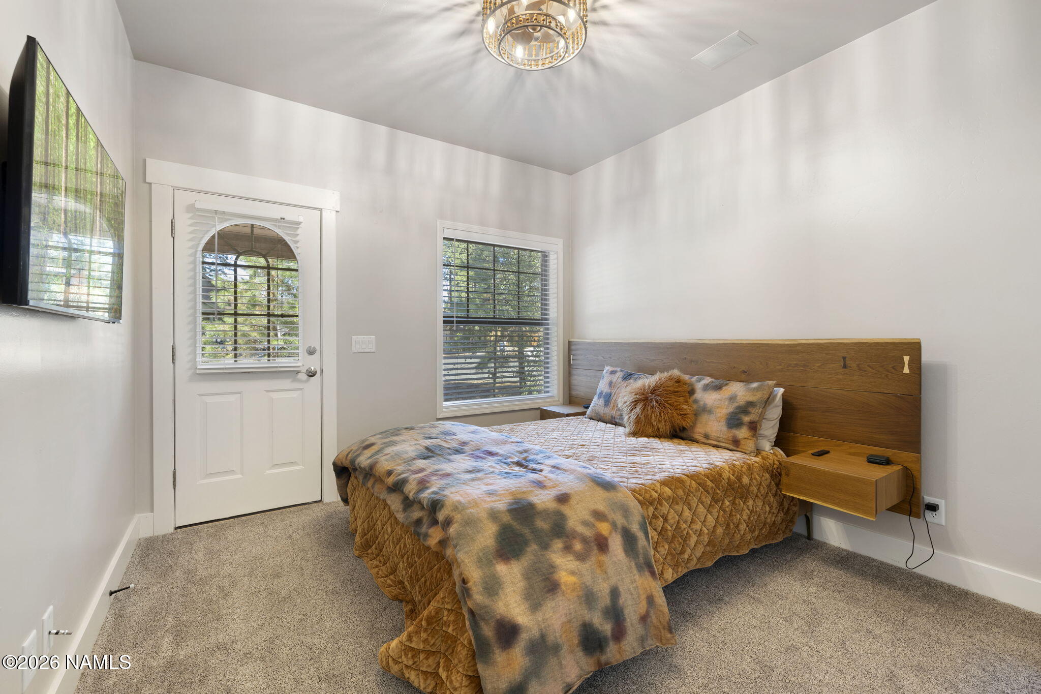 3495 West Lead Rope Flagstaff, AZ 86005 - Photo 28 of 49 a bedroom with a bed and a window