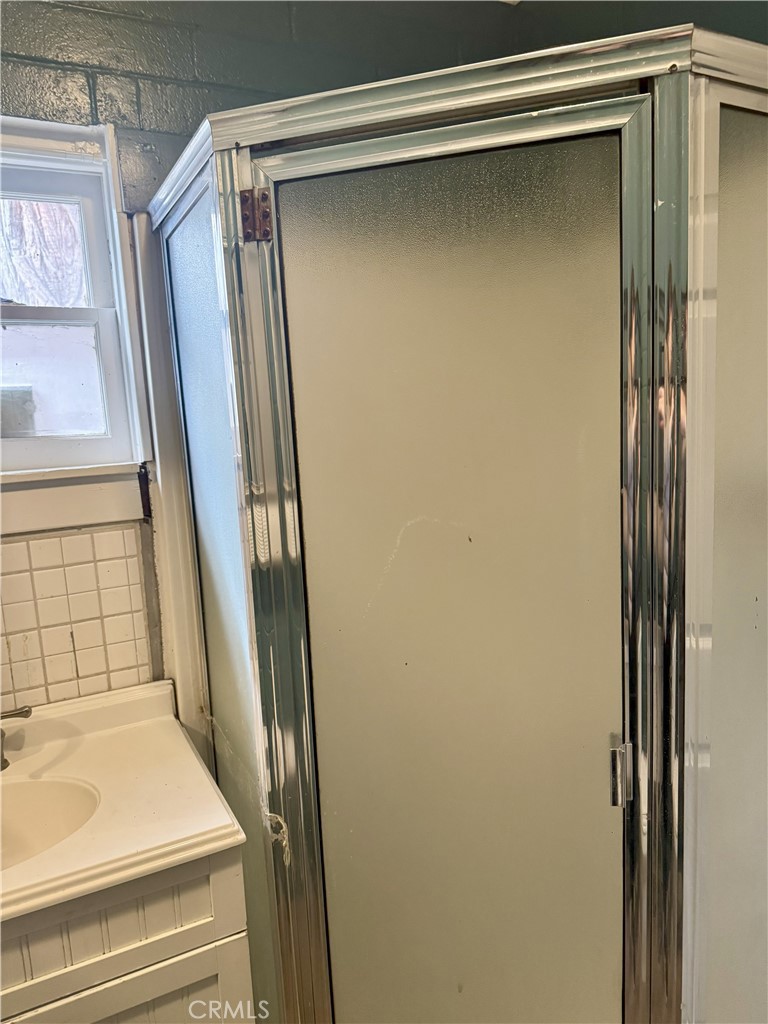 197 Western Drive Cedar Glen, CA 92321 - Photo 12 of 17 a bathroom with a shower and a mirror