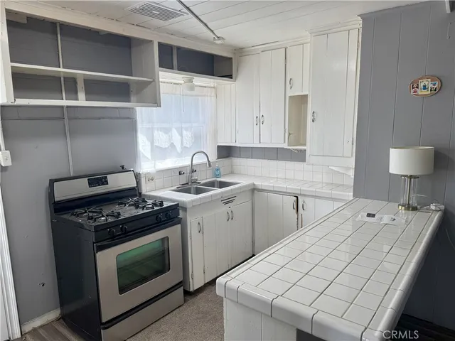 a kitchen with a stove and a sink