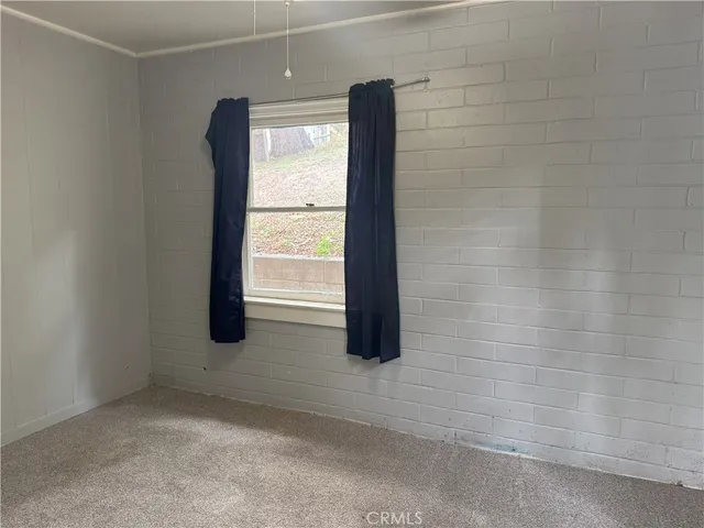 a view of an empty room and window