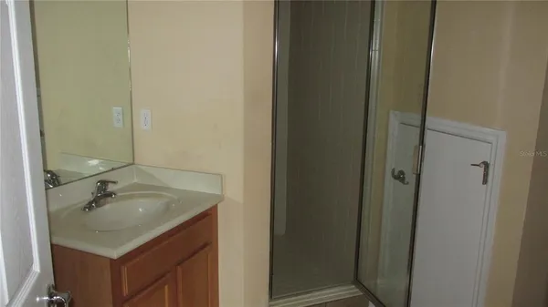 a bathroom with a sink and mirror