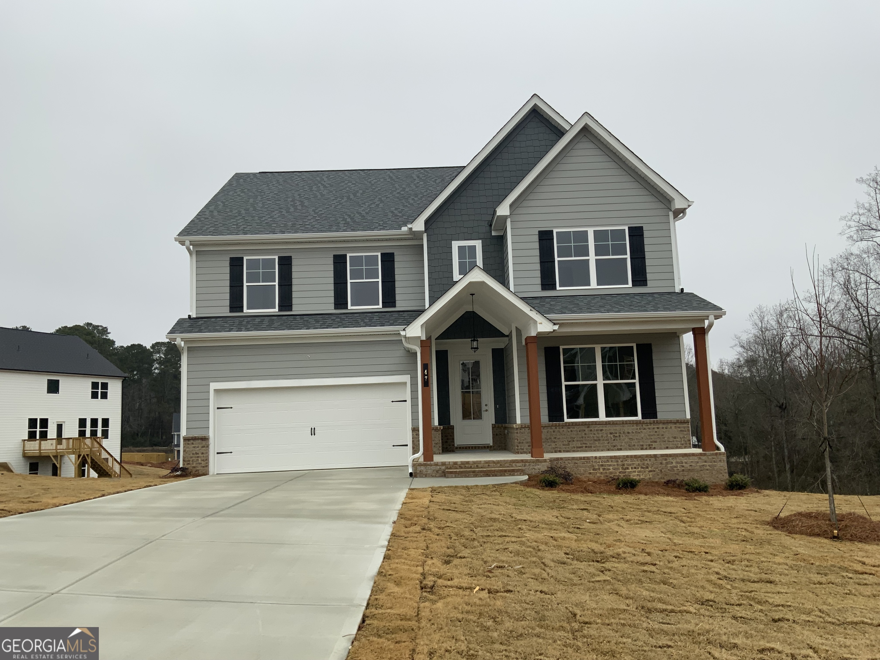 47 Shelby Court, Unit HOMESITE 28 Commerce, GA 30529 - Photo 2 of 17 a front view of a house with a garage