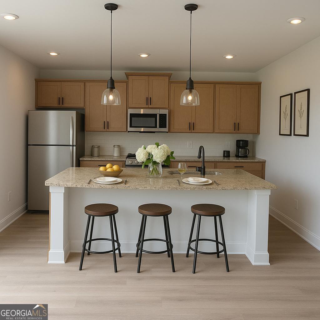 47 Shelby Court, Unit HOMESITE 28 Commerce, GA 30529 - Photo 6 of 17 a kitchen with stainless steel appliances kitchen island a table chairs in it and white cabinets