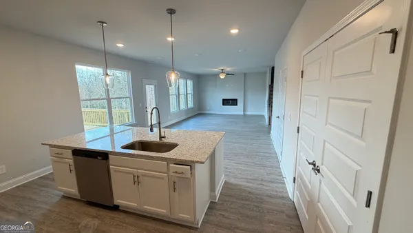 a kitchen with sink and window