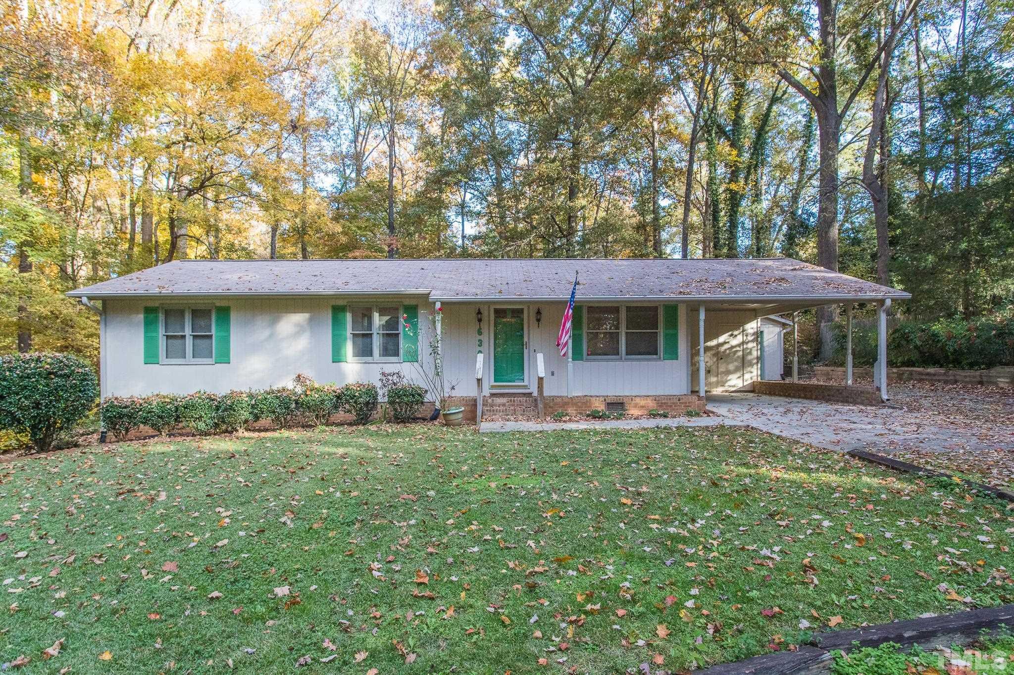 6304 Garrett Road Raleigh, NC 27606 - Photo 1 of 15 a front view of a house with a yard