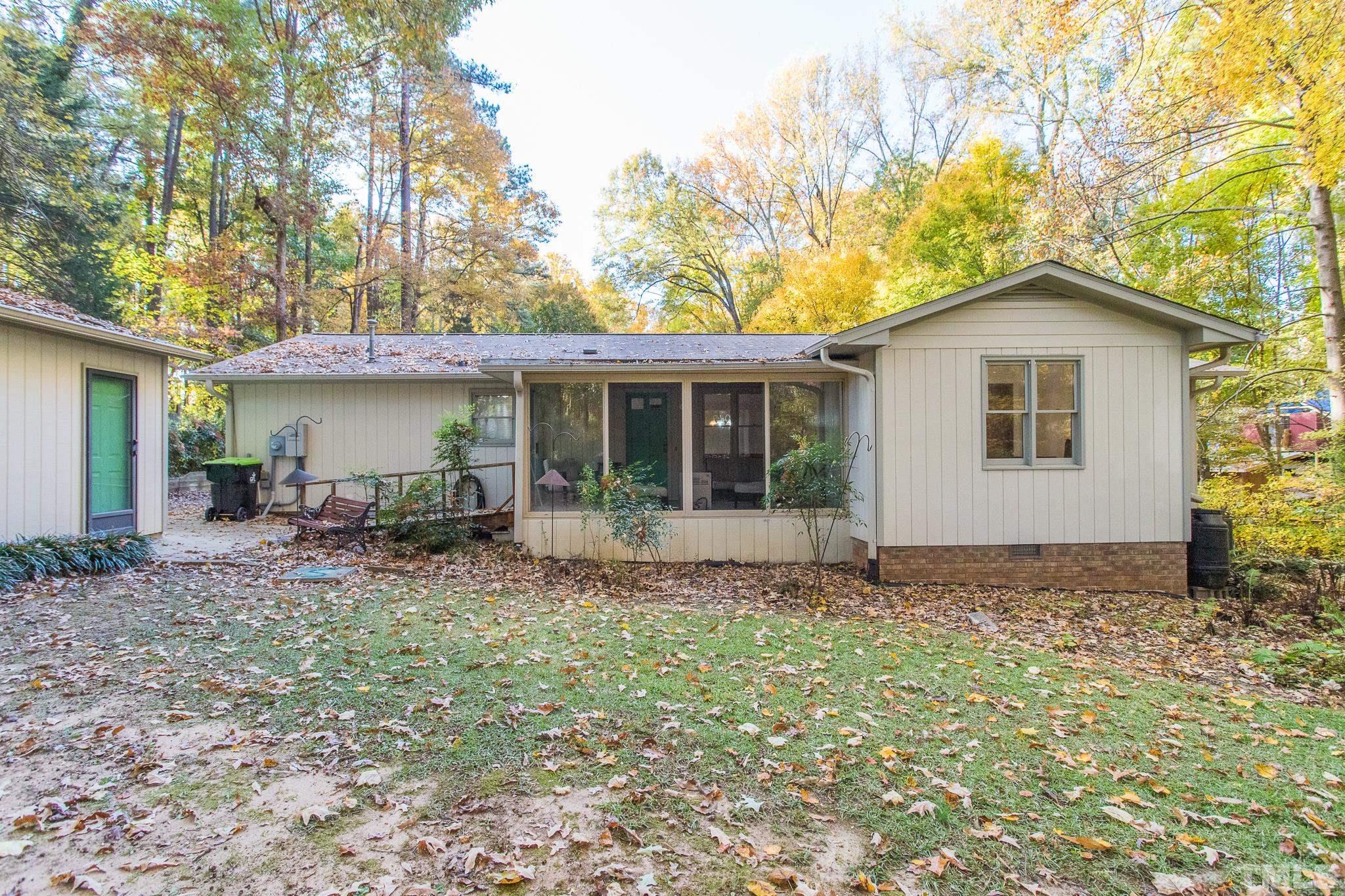 6304 Garrett Road Raleigh, NC 27606 - Photo 14 of 15 a view of house with backyard and garden