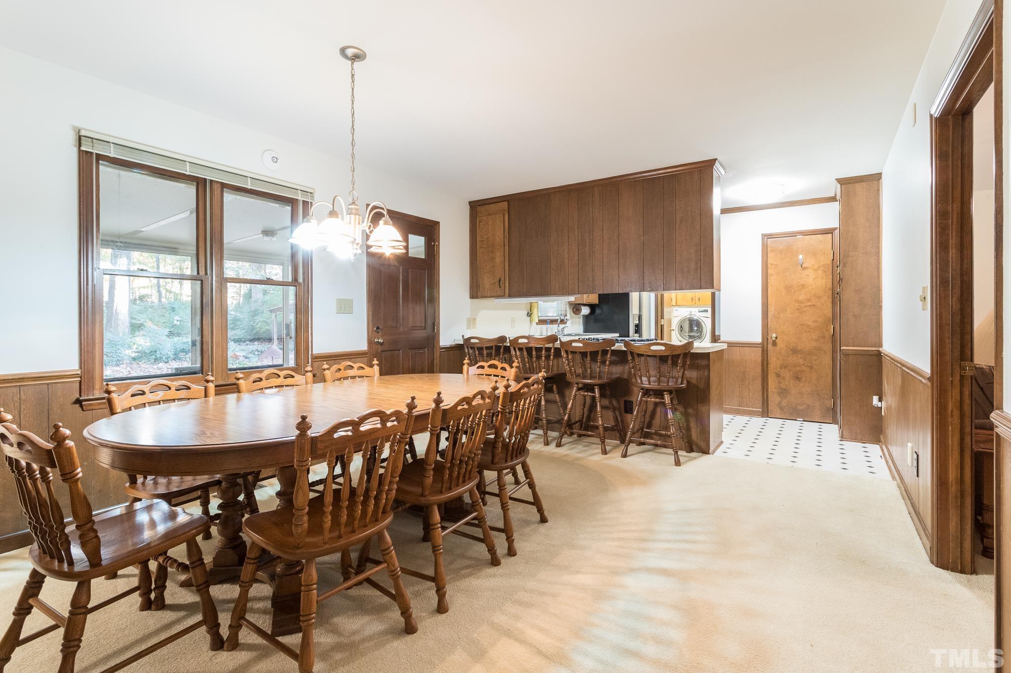 6304 Garrett Road Raleigh, NC 27606 - Photo 7 of 15 a view of a dining room with furniture window and outside view
