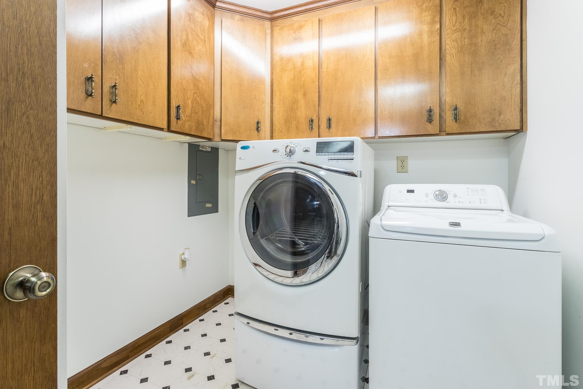 6304 Garrett Road Raleigh, NC 27606 - Photo 8 of 15 a utility room with dryer and washer