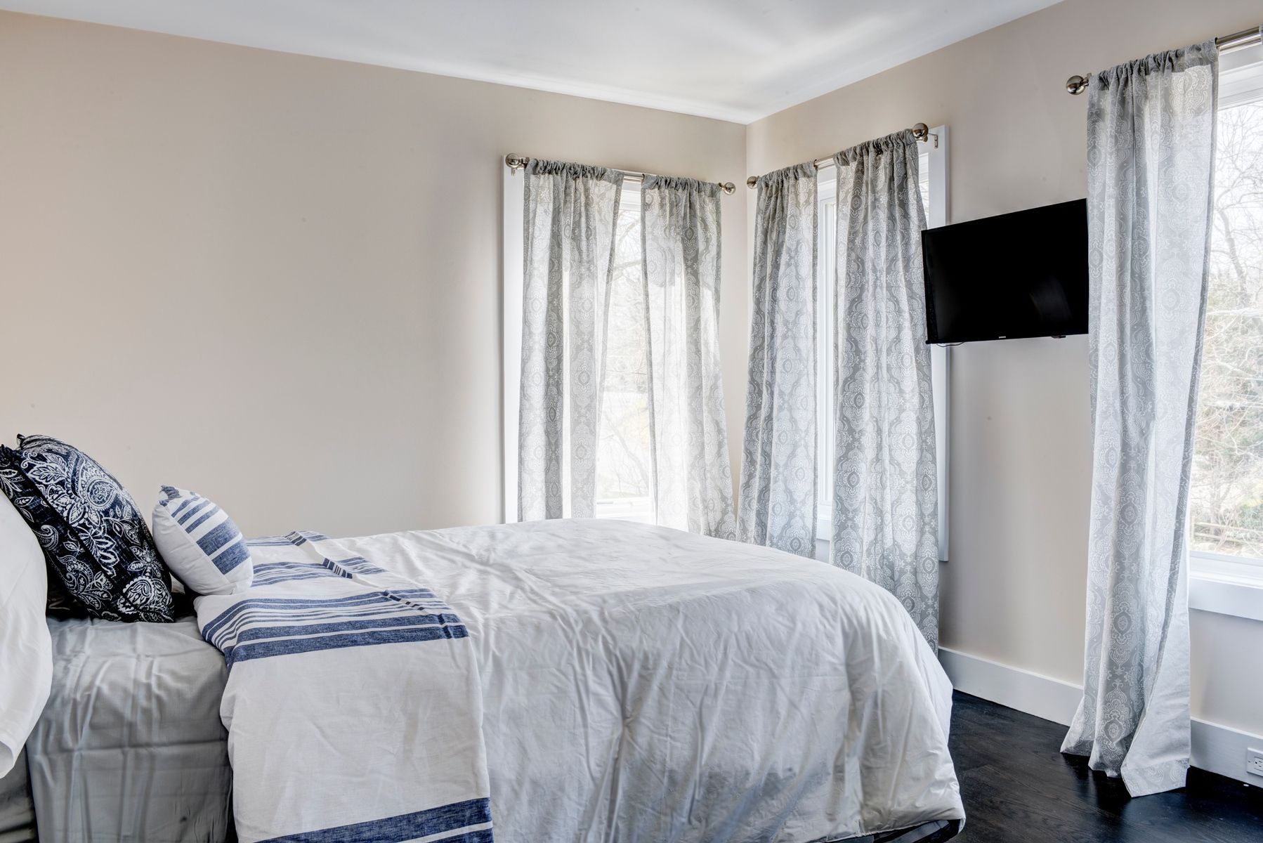 Undisclosed Address Sag Harbor, NY 11963 - Photo 11 of 11 a bedroom with a bed window and television