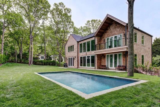 a view of a house with a yard and plants