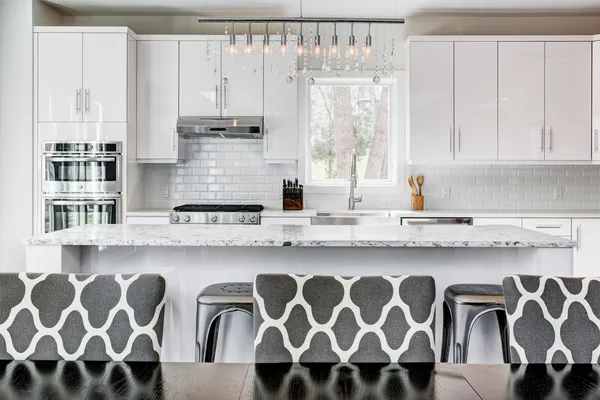 a kitchen with stainless steel appliances granite countertop a sink and a cabinets