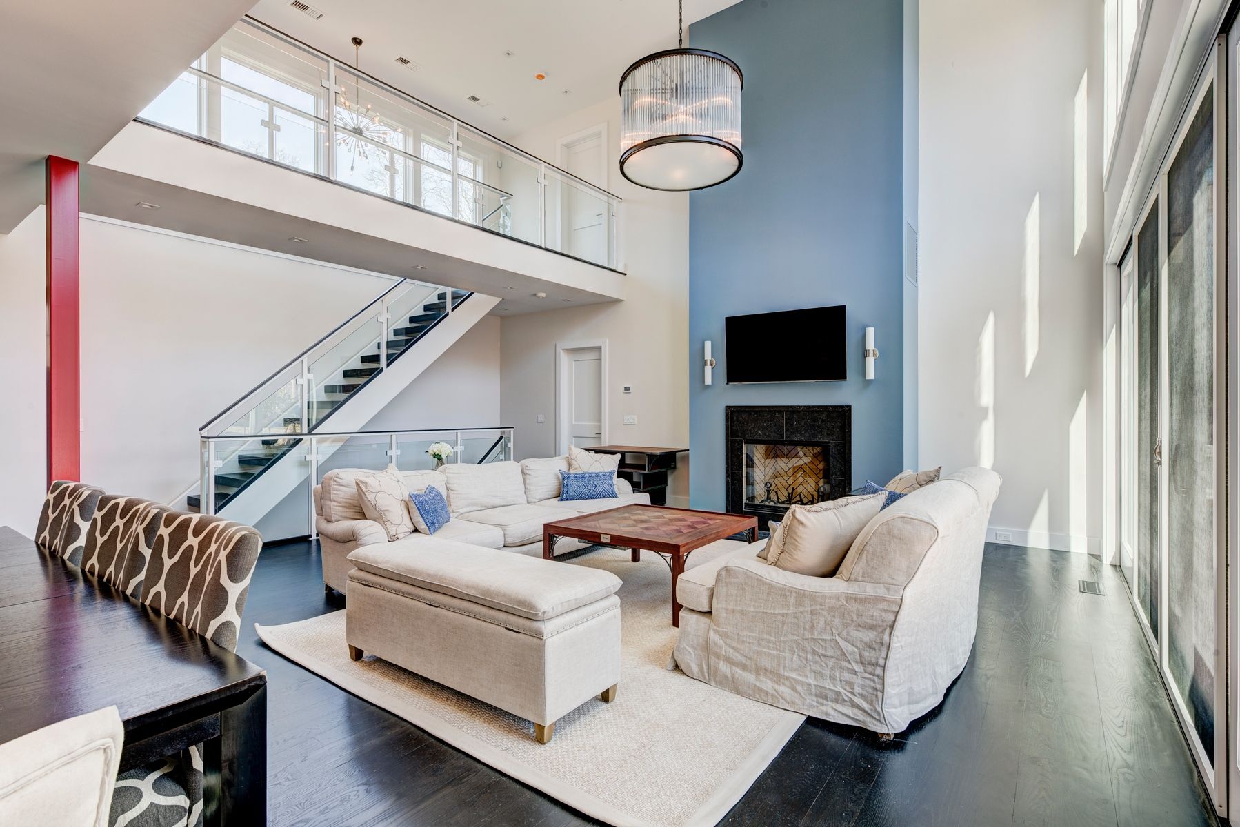Undisclosed Address Sag Harbor, NY 11963 - Photo 5 of 11 a living room with furniture a fireplace and a large window