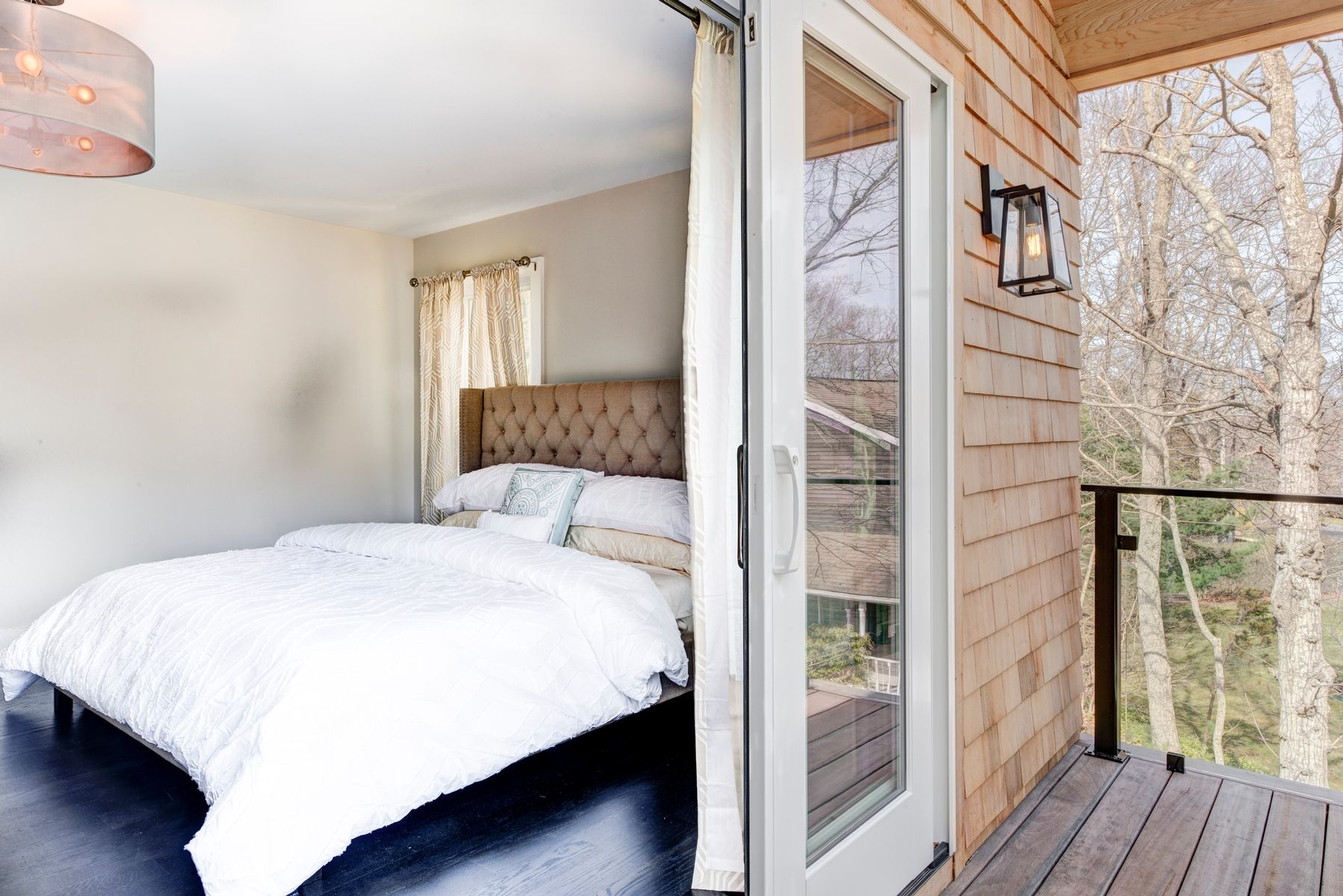 Undisclosed Address Sag Harbor, NY 11963 - Photo 7 of 11 a bedroom with a bed and wooden floor