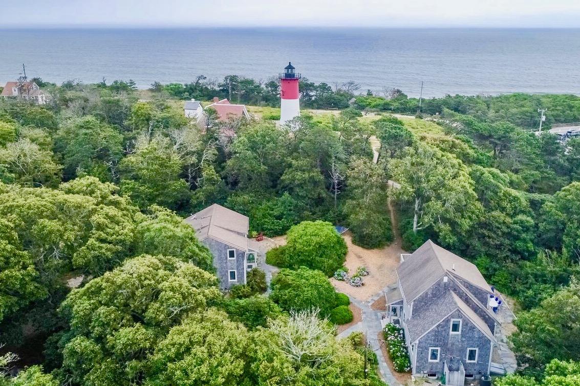 935 Cable Road Eastham, MA 02642 - Photo 2 of 35 an aerial view of a house with a yard and lake