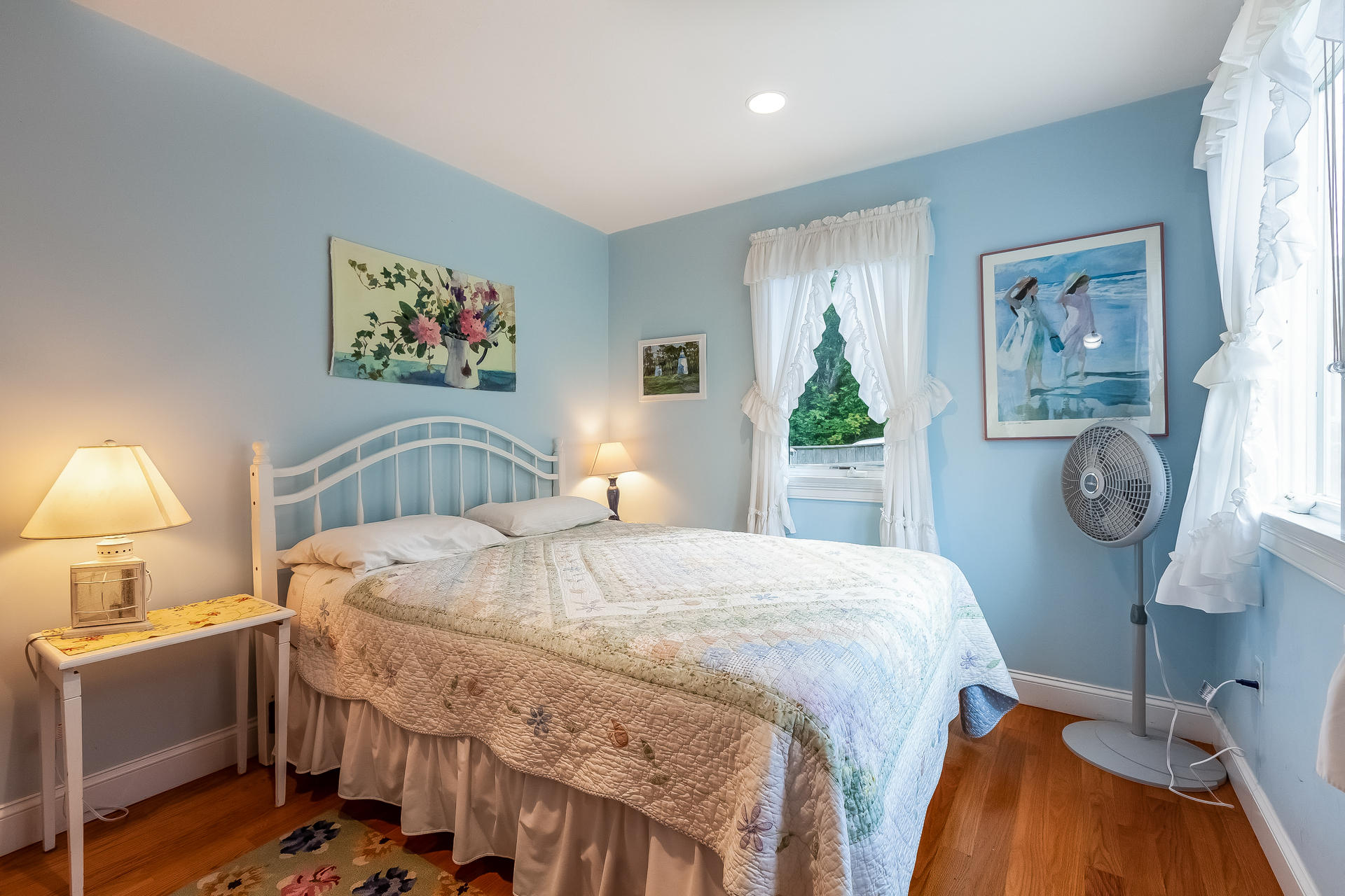 935 Cable Road Eastham, MA 02642 - Photo 28 of 35 a bedroom with a bed and a lamp on table