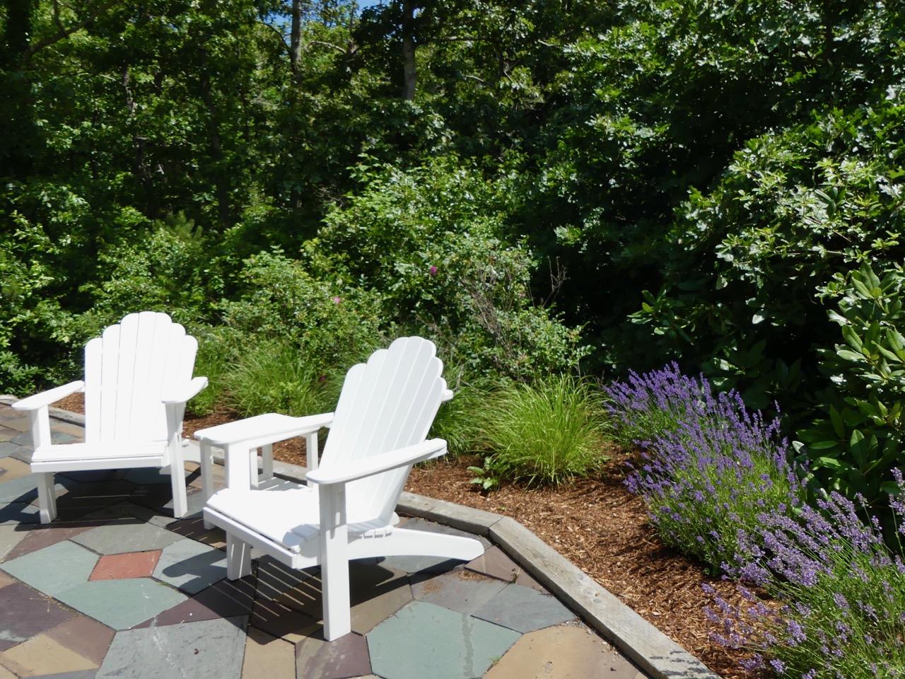935 Cable Road Eastham, MA 02642 - Photo 35 of 35 a view of a chairs and table in backyard