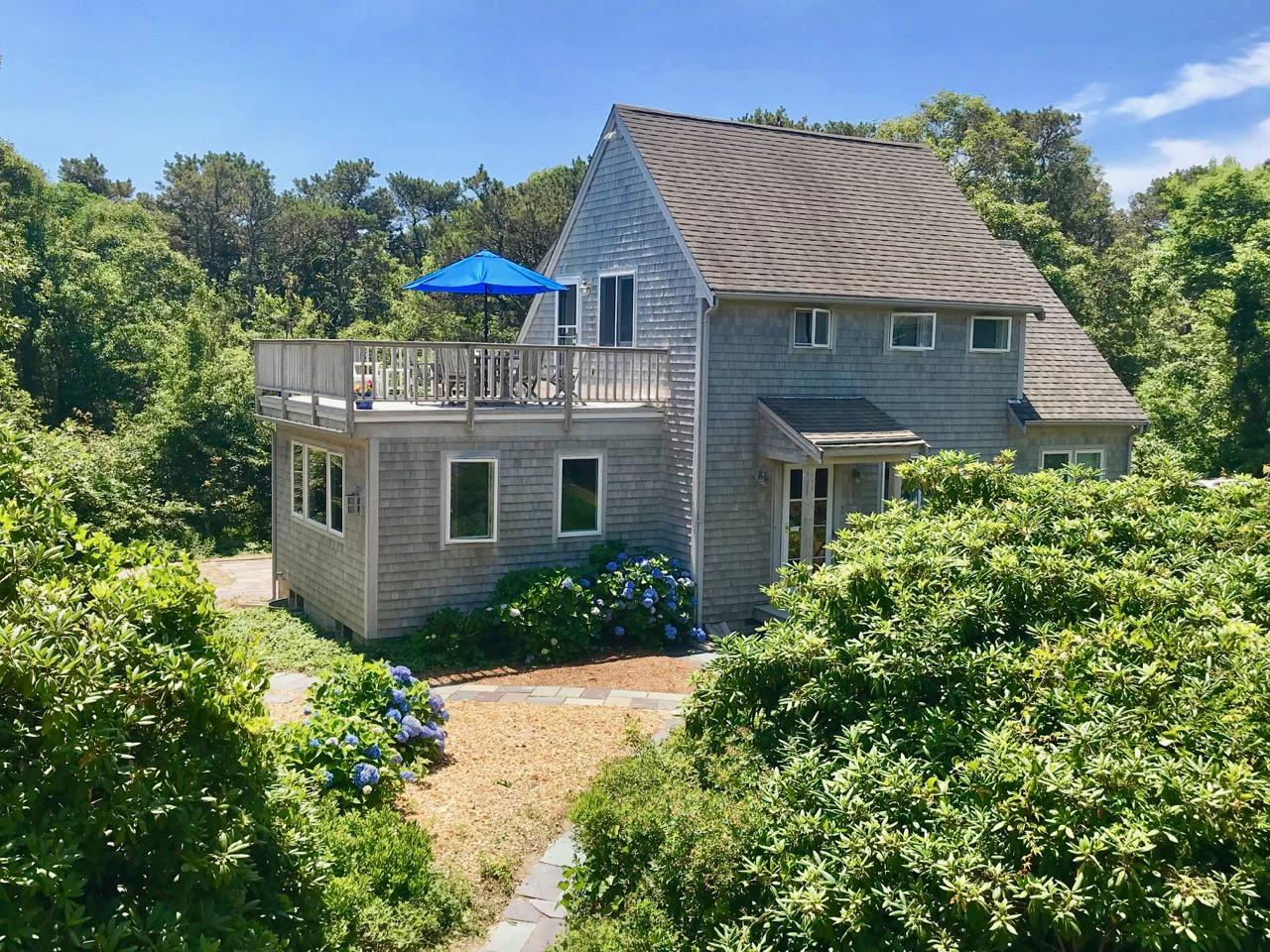 935 Cable Road Eastham, MA 02642 - Photo 5 of 35 a front view of a house with a yard