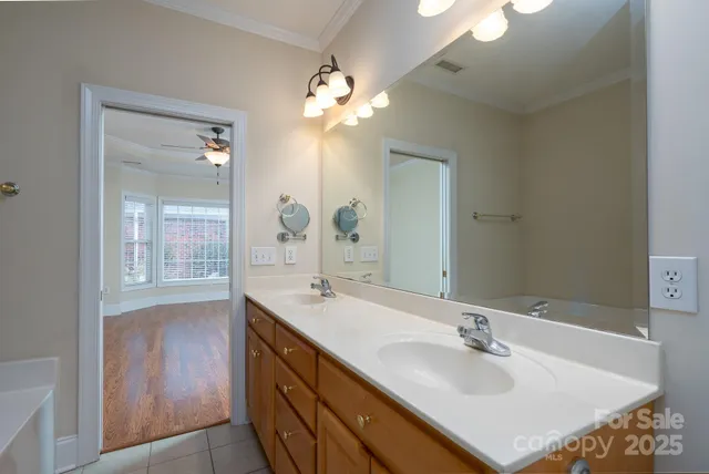 a bathroom with a sink double vanity and a mirror