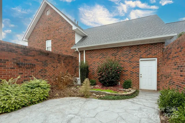 a view of a house with potted plants