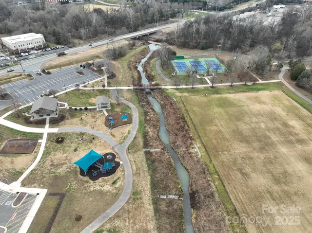 a view of a brick building next to a yard
