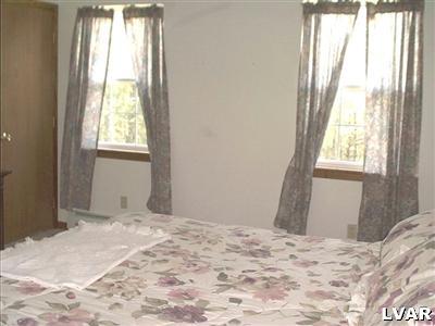 21 Roman Road Kunkletown, PA 18058 - Photo 6 of 8 a bedroom with a bed and a window