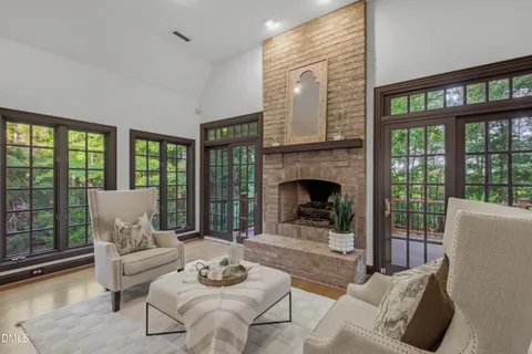 a kitchen with stainless steel appliances granite countertop a refrigerator a sink a stove and island