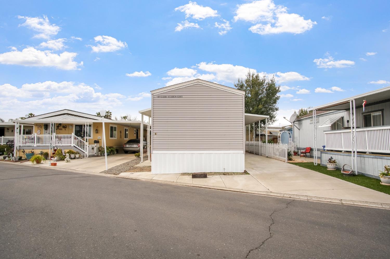 1400 Meredith Avenue, Unit 81 Gustine, CA 95322 - Photo 2 of 29 a view of a street with cars