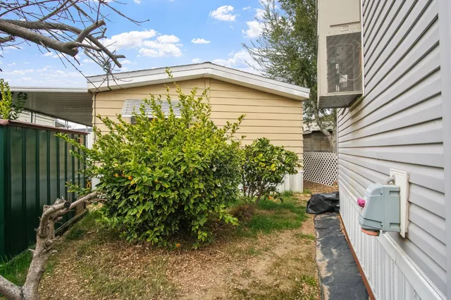 a view of a balcony with wooden fence