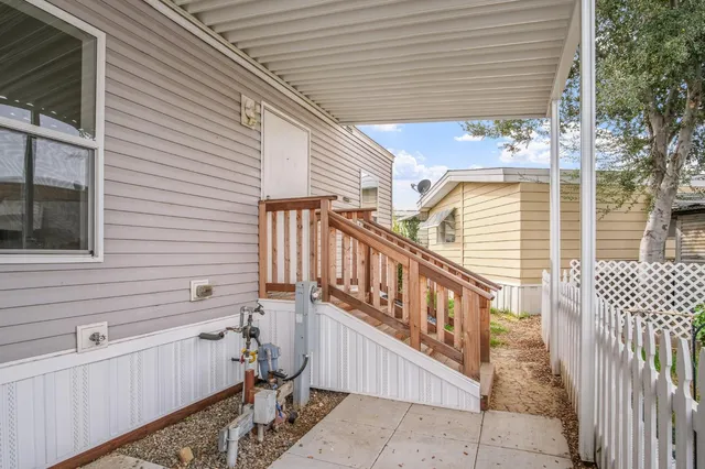 a view of a balcony with chairs