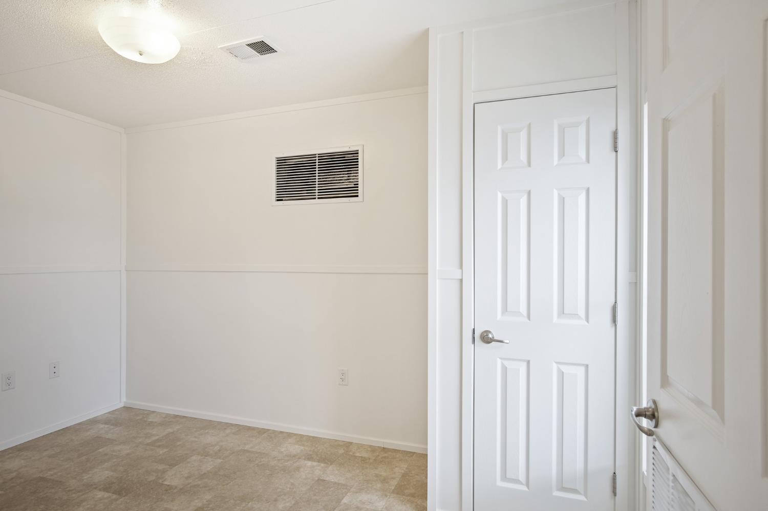 1400 Meredith Avenue, Unit 81 Gustine, CA 95322 - Photo 9 of 29 an empty room with windows