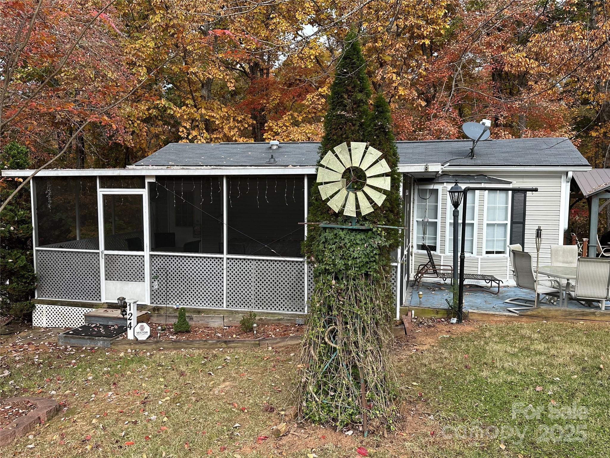 124 Hummingbird Circle New London, NC 28127 - Photo 1 of 48 a view of a house with backyard and sitting area