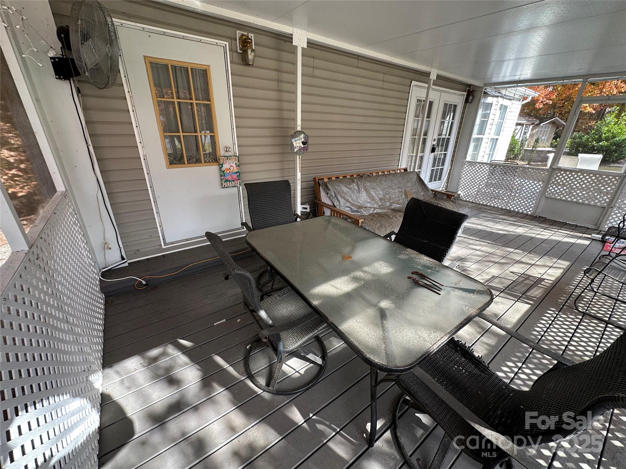 124 Hummingbird Circle New London, NC 28127 - Photo 19 of 48 a view of a dining room with furniture and wooden floor